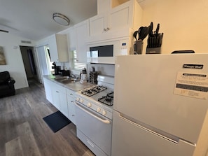 Fridge, microwave, stovetop, coffee/tea maker