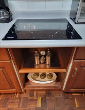 Fridge, microwave, stovetop, coffee/tea maker