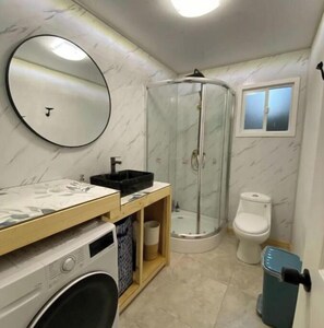 Shower, hair dryer, towels, soap
