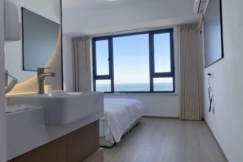 Dalian Huafa New Town Hotel Apartment