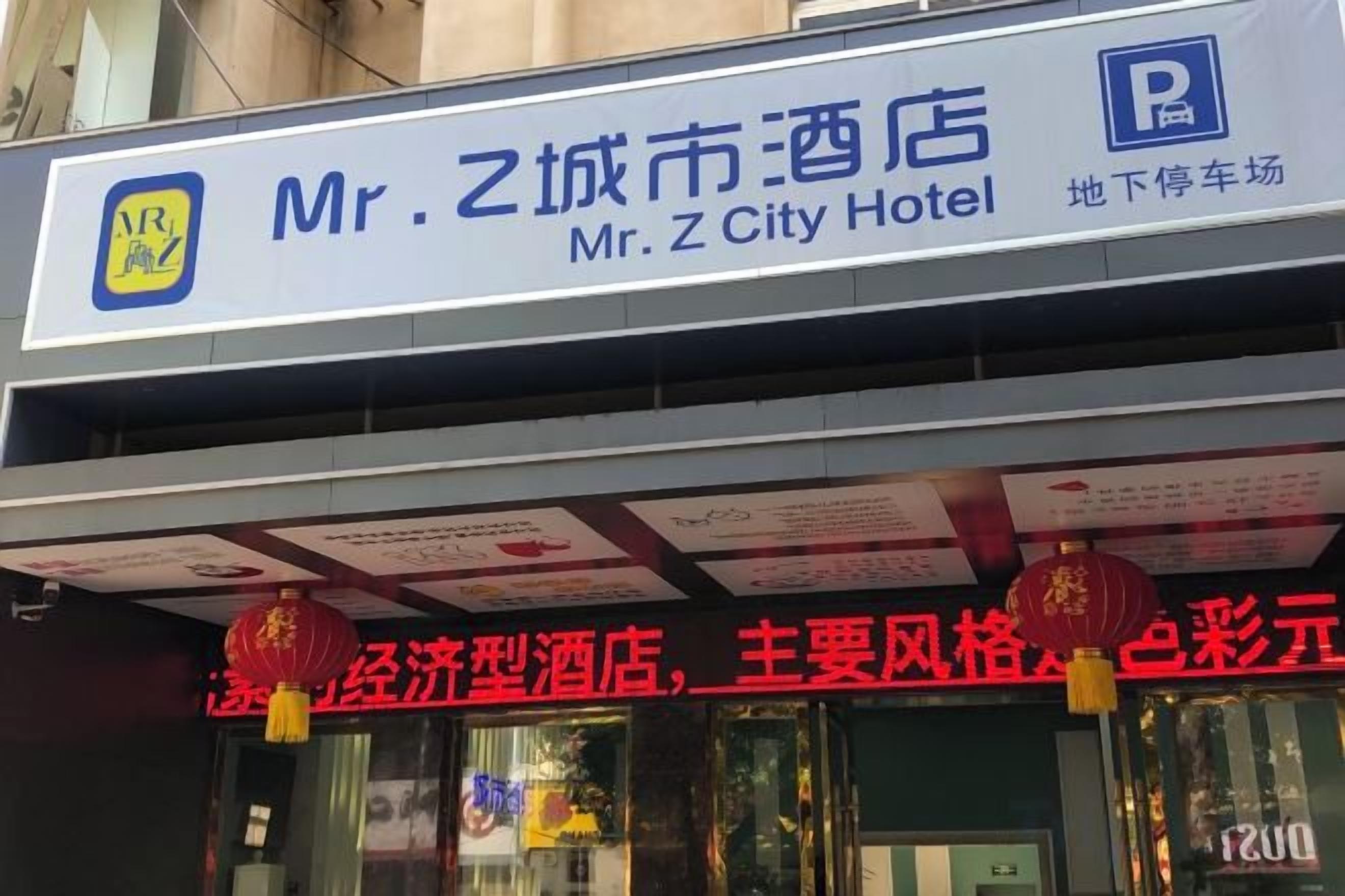 A hotel sign with 'Mr. Z City Hotel' and a parking sign.