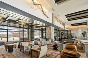 A spacious lobby with modern furniture, large windows, and a decorative wall piece. - Luxury  @Deer Valley East Village - Private residence - sleeps 8 (Park City)