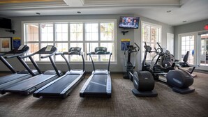 A gym with treadmills, elliptical machines, and weight equipment. - 5BD Sleeps 14 Mickey Home with Arcade Pool and BBQ (Davenport)