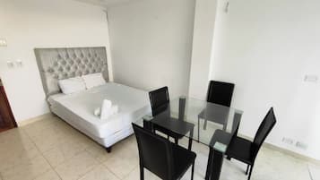 Basic Apartment | Living area | Flat-screen TV