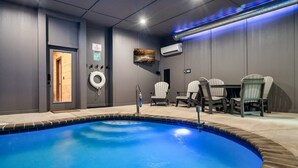 A swimming pool with a tiled edge, a door, and a seating area with chairs. - Cabin·Indoor Pool·Sauna·Game Rm·Creek·15 Min to NP (Sevierville)