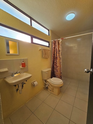 Shower, hair dryer, towels, soap