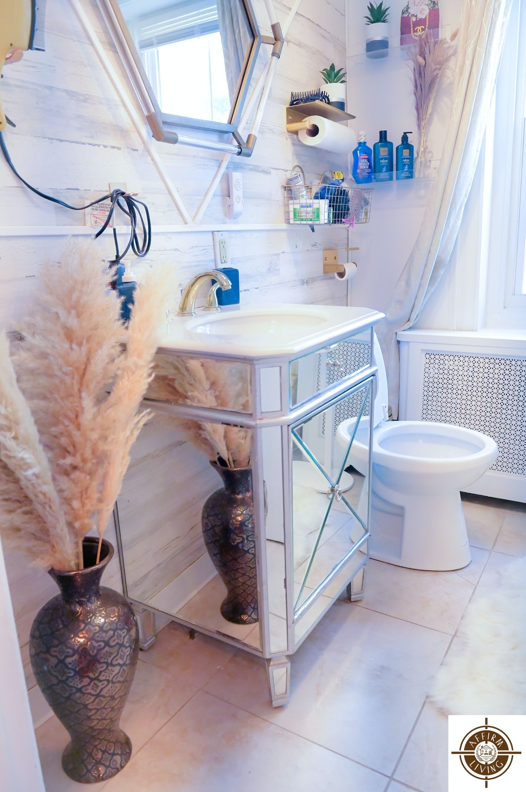 A modern bathroom with a skylight, a vanity with a glass enclosure, a toilet, and a radiator.
