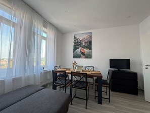 Exclusive Apartment | Living area | 55-inch LED TV with cable channels