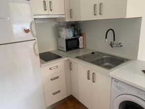 Fridge, microwave, coffee/tea maker, toaster