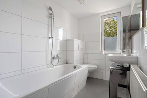 Shower, hair dryer, towels