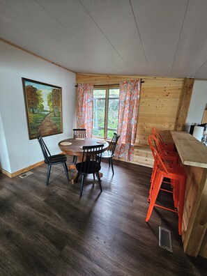 Dining - Hot tub, boat dock and lakeside with this snug small cabin. TINY BEDROOMS (Eucha)