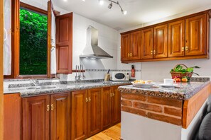 Fridge, microwave, stovetop, coffee/tea maker