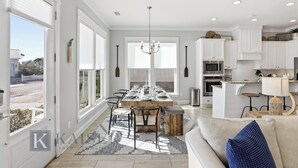 A modern kitchen with white cabinetry, a built-in oven, and a microwave. - Park's Edge Home | Pool, Bike Trails, Beach Access | Three Seas Villa by Kaiser (Orange Beach)