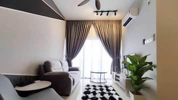 Standard Apartment | Living area | 32-inch flat-screen TV with digital channels