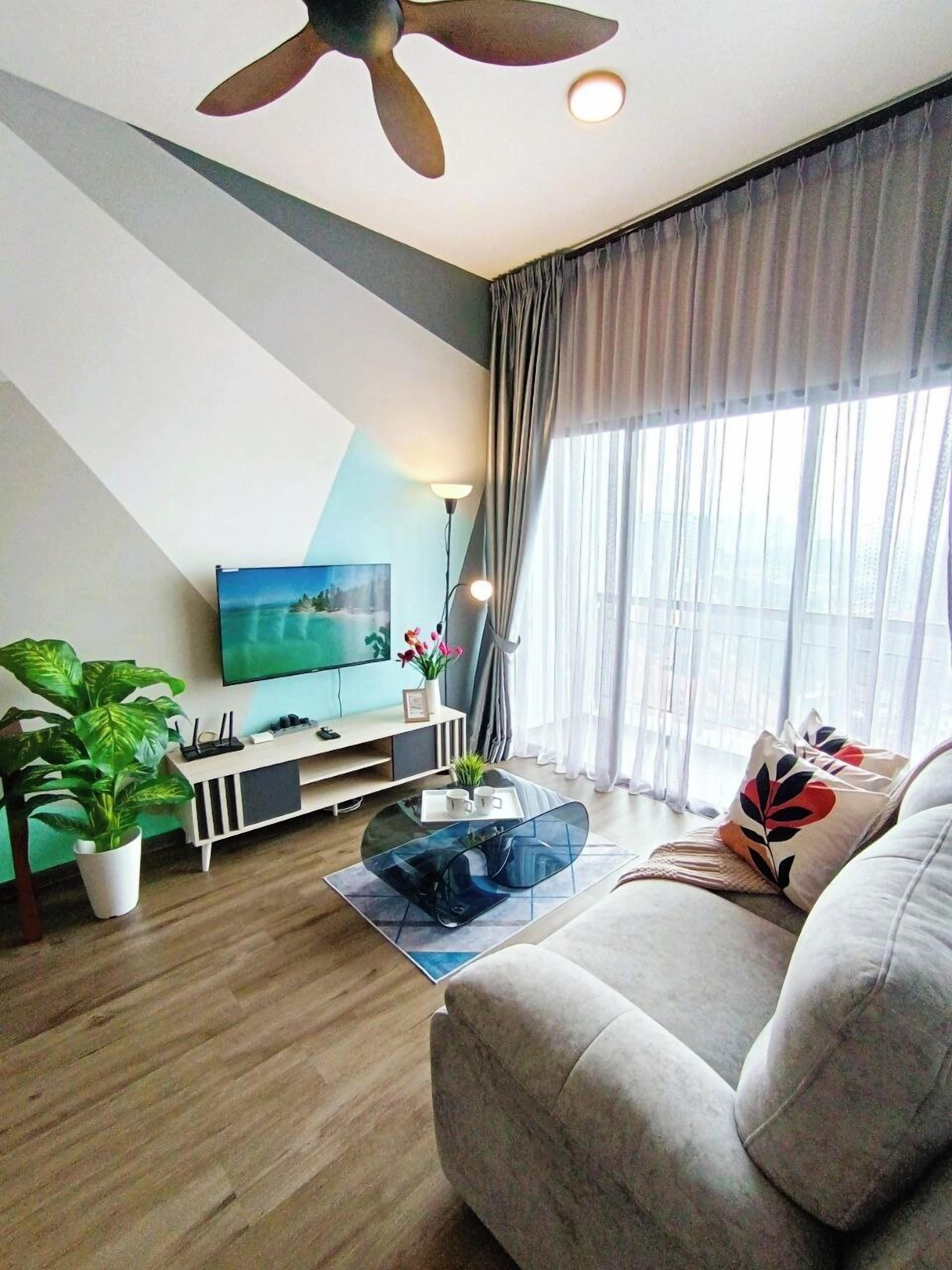 Executive Apartment | Living area | 32-inch flat-screen TV with digital channels