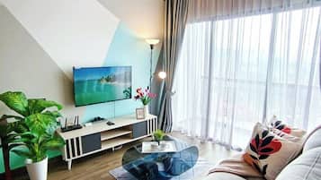 Executive Apartment | Living area | 32-inch flat-screen TV with digital channels