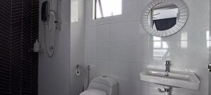 A bathroom with a toilet, a sink, a mirror, and a shower. - Belle Vue Infinity Suites l The Horizon Ipoh l by Grab A Stay l 1-8pax (Ipoh)