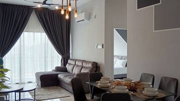 Apartment, City View | Living area | 32-inch flat-screen TV with digital channels