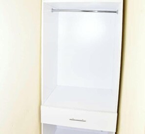 A white wardrobe with a single drawer and a rod at the top. - shem motel (Migwani)