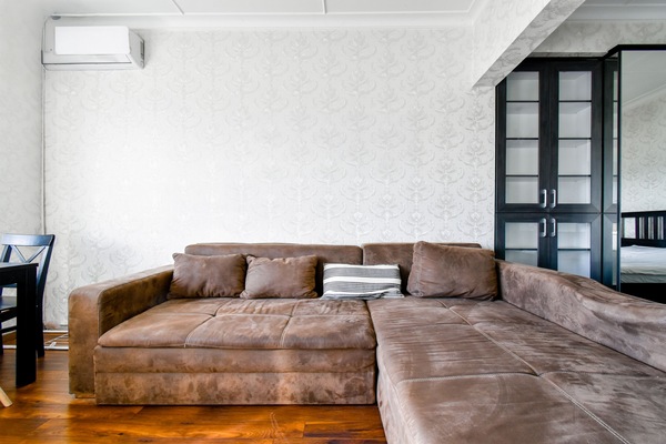 Spacious and inviting living room with a comfortable sofa—perfect for unwinding after a day of exploring.