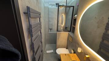 Luxury Studio Suite | Bathroom | Designer toiletries, hair dryer, bathrobes, slippers