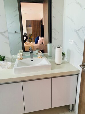 Shower, towels, soap, toilet paper