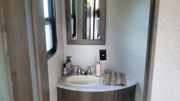 Shower, towels, soap, toilet paper