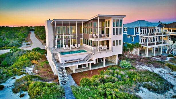 A modern beachfront house with a large balcony, a swimming pool, and a view of the beach. - Sugar Sands Sanctuary: Breathtaking Beach Views, Private Pool, 6 Bedrooms ! (St. George Island)