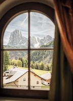 Tower room with balcony and Dolomite view | In-room safe, individually decorated, individually furnished, desk