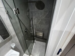 Shower, towels, soap, toilet paper