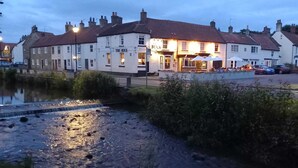A riverside pub with a traditional white facade and a sign reading "The Buck". - The Buck Hotel (Middlesbrough)