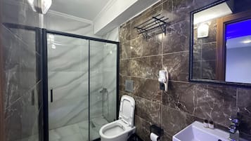 Shower, hair dryer, slippers, towels
