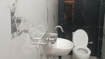 Deluxe Double Room, City View | Bathroom | Free toiletries, slippers, towels, soap