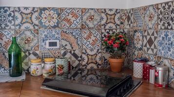 Fridge, stovetop, coffee/tea maker, cookware/dishes/utensils