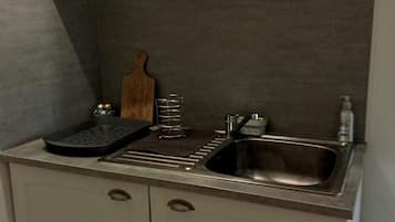 Fridge, microwave, stovetop, coffee/tea maker