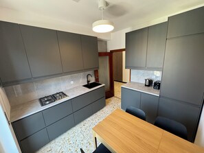 Fridge, microwave, stovetop, coffee/tea maker