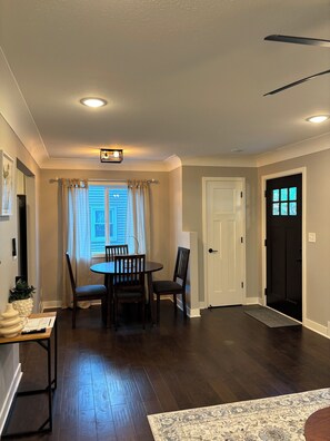 Enjoy meals in the dining area with a round table and four chairs.