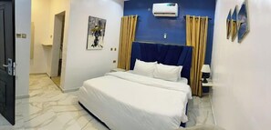 Deluxe Room, Balcony, City View | Desk, laptop workspace, free WiFi - Babcock Guest House (Ilishan)