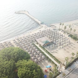 Private beach, beach umbrellas, beach towels, beach volleyball