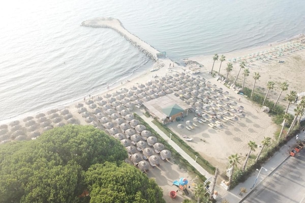 Private beach, beach umbrellas, beach towels, beach volleyball