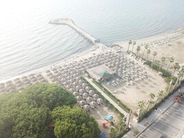 Private beach, beach umbrellas, beach towels, beach volleyball