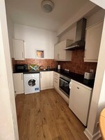 Comfort Apartment, Garden View | Private kitchen | Dining tables