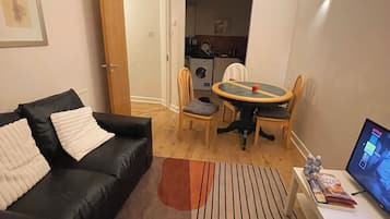Appartement Confort, vue jardin | Coin séjour
