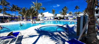 Enjoy the beach Steps Away, Golf, Pickleball,4 heated pools, tennis, &much more 