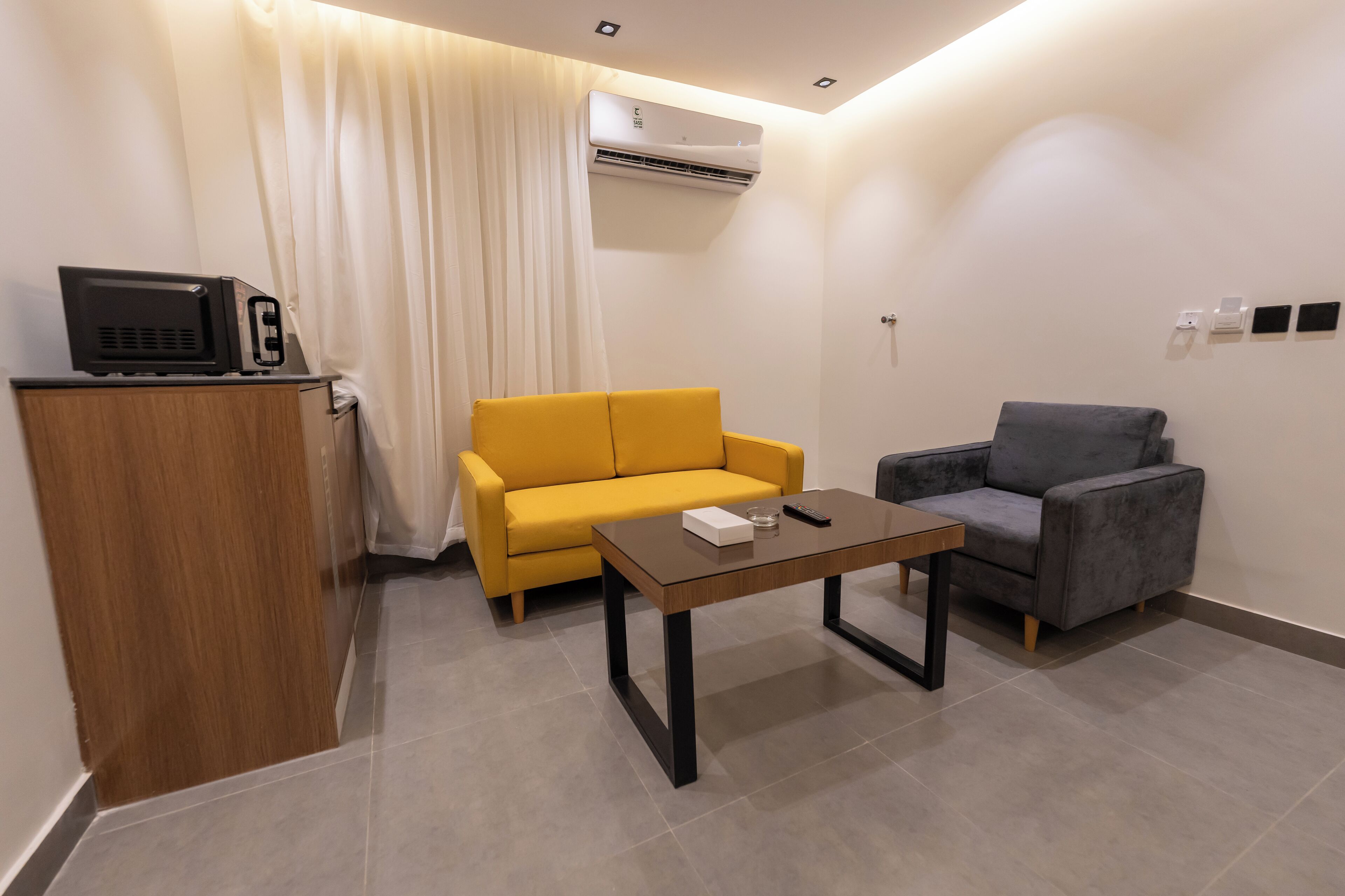 Family Suite | Living area | 45-inch flat-screen TV with satellite channels