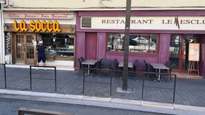 A restaurant named 'La Socca' with outdoor seating and a person preparing food. - The blue tide  (Nice)