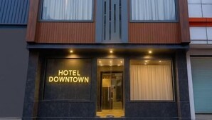 A modern hotel building with a prominent 'HOTEL DOWNTOWN' sign. - Hotel Downtown by Quadis - Sector 15 Noida (Noida)