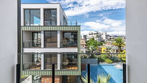 A modern two-story building with large windows and a balcony. - Ning Xia Time Villa (Dongshan)