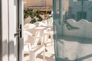 Classic Triple Room | Terrace/patio - Dilino Hotel (Santorini)