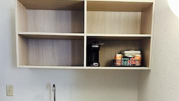 Full-size fridge, microwave, stovetop, coffee/tea maker